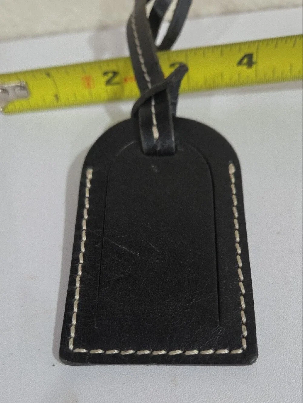 Dooney & Bourke Black Leather Tag with Embossed Logo